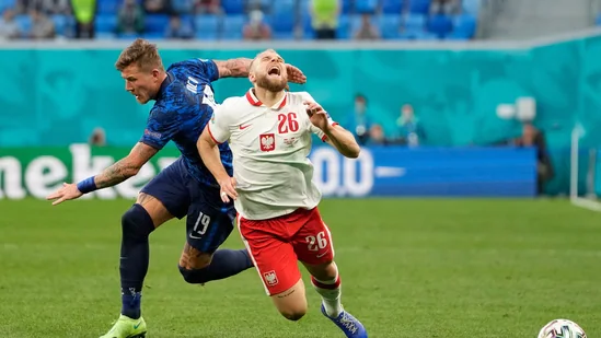 Slovakia's Juraj Kucka in action with Poland's Tymoteusz Puchacz.(Pool via REUTERS)
