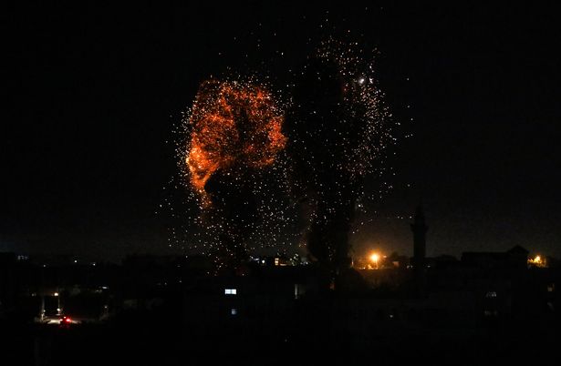 Flames are seen after an Israeli air strike hit Hamas targets