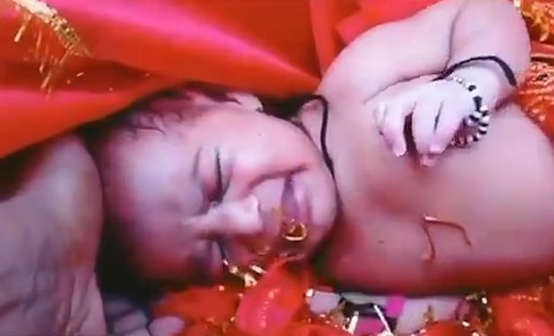 The baby girl was found wrapped in a red blanket and placed inside a wooden box