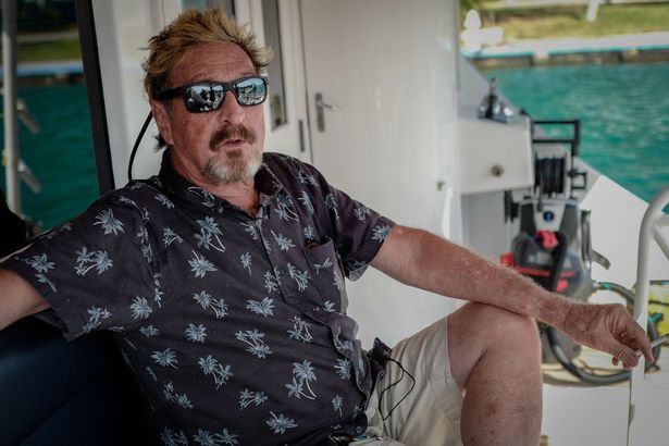 John McAfee gesturing during an interview with AFP on his yacht anchored at the Marina Hemingway in Havana