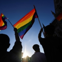 Demonstrators protest against Hungarian Prime Minister Viktor Orban and the latest anti-LGBTQ law, in Budapest on June 14. | REUTERS