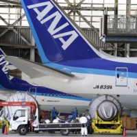 All Nippon Airways Co. began vaccinating its employees against COVID-19 on Sunday. The airline is believed to be the first among Japanese firms to have started workplace vaccinations for staff. | BLOOMBERG