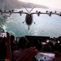 Attendees watch as the Archer Aviation Maker is unveiled on Thursday in Hawthorne, California. | AFP-JIJI