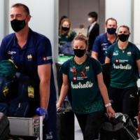 Member's of Australia's Olympic softball squad arrive at Narita International Airport on Tuesday. | POOL / VIA REUTERS