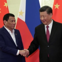 Chinese President Xi Jinping meets with Philippine President Rodrigo Duterte at the Great Hall of People in Beijing in April 2019.   | POOL / VIA REUTERS