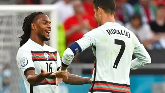 Portugal's Renato Sanches, left, and Portugal's Cristiano Ronaldo celebrate their victory during the Euro 2020 soccer championship group F match between Hungary and Portugal at the Ferenc Puskas stadium in Budapest, Hungary, Tuesday, June 15, 2021. (Tibor Illyes/Pool via AP)(AP)