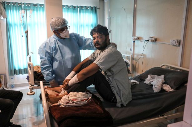 Doctors examines a patient