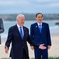 European Council President Charles Michel (left) U.S. President Joe Biden and Prime Minister Yoshihide Suga take a family photo on the first day of the Group of Seven leaders summit in Carbis Bay, England, on Friday.  | EPA / VIA BLOOMBERG