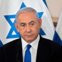 Israeli Prime Minister Benjamin Netanyahu looks on during a briefing at the Hakirya military base in Tel Aviv on May 19.  | POOL / VIA AFP-JIJI