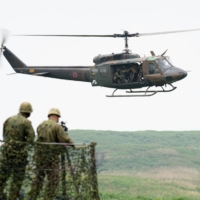 Self-Defense Forces troops take part in a training exercise in the East Fuji Manuever Area in Gotemba, Shizuoka Prefecture, on May 22.  | POOL / VIA AFP-JIJI