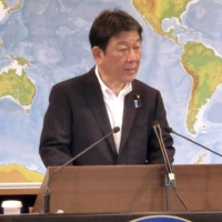 Foreign Minister Toshimitsu Motegi speaks at a news conference in Tokyo on Tuesday. | KYODO