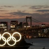 The Cabinet Office's latest monthly report did not refer to the economic impact of the Tokyo Olympics starting on July 23, with an official saying the major international sporting event is expected to deliver only a small boost in consumption. | REUTERS