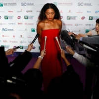 Naomi Osaka speaks to media after the singles draw ceremony of the WTA Tennis Finals in Singapore in October 2018. In the time since, the tennis star has figured out how to get through news conferences without compromising her values. | REUTERS