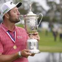 Jon Rahm kisses the trophy after winning the U.S. Open at Torrey Pines in San Diego, on Sunday. | USA TODAY / VIA REUTERS