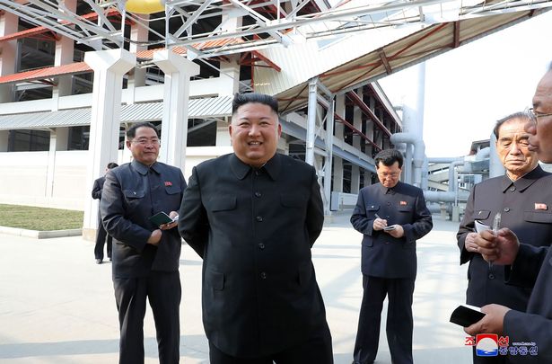 North Korean leader Kim Jong Un (2nd L) visiting the completed Suchon phosphate fertilizer factory in South Pyongan Province, North Korea