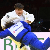 Sara Asahina (white) fights Wakaba Tomita in the women's over-78-kg category at the 2021 Judo World Championships on Saturday in Budapest. | AFP-JIJI