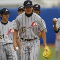 Masahiro Tanaka (center) practices with his teammates at Wukesong Sports Center Baseball Field in Beijing during the 2008 Olympics. | REUTERS