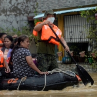 Residents on a rescue boat are evacuated from their flooded houses following Typhoon Vamco in Rizal Province, Philippines, in November 2020. | REUTERS