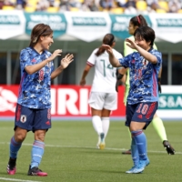 Nadeshiko Japan's Mana Iwabuchi (left) celebrates with Yuka Momiki after scoring the team's first goal against Mexico on Sunday in Tochigi. | KYODO