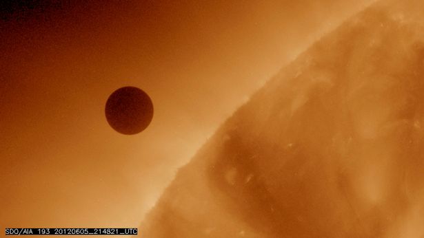 NASA's handout image shows Venus at the start of its transit of the Sun