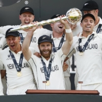 NEW ZEALAND CAPTAIN KANE WILLIAMSON CELEBRATES WITH HIS TEAM AFTER BECOMING THE WORLD TEST CHAMPIONS ON WEDNESDAY.