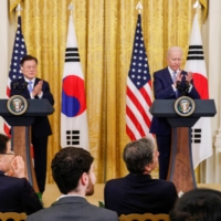 Sung Kim stands after U.S. President Joe Biden announced Kim would serve as a special U.S. envoy for North Korea, during a joint news conference with South Korea's President Moon Jae-in at the White House, in Washington, on May 21. | REUTERS