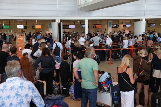 The race to get home has led to big queues at Faro Airport