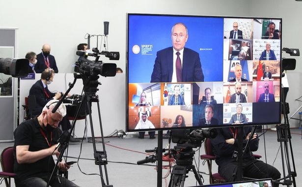 Vladimir Putin attending the press conference via video link