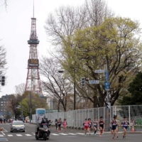 Athletes compete in a half-marathon race which doubles as a test event for the 2020 Tokyo Olympics, in Sapporo, on May 5. | POOL / VIA REUTERS