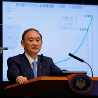 Prime Minister Yoshihide Suga speaks during a news conference at his official residence in Tokyo on Thursday. | AFP-JIJI