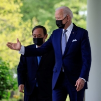 U.S. President Joe Biden and Prime Minister Yoshihide Suga arrive for a joint news conference in the Rose Garden at the White House on April 16. | REUTERS