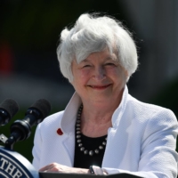 U.S. Treasury Secretary Janet Yellen smiles during a news conference at Winfield House in London on Saturday after attending the Group of Seven finance ministers' meeting.  | POOL / AFP-JIJI