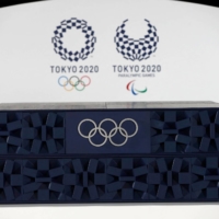 The podium to be used for the medal ceremonies at the Tokyo 2020 Olympics Games is seen during an event to mark 50 days to the opening ceremony, at Ariake Arena in Tokyo on June 3. | POOL / AFP-JIJI