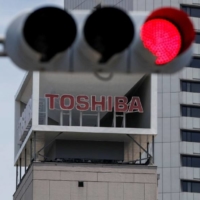 Toshiba won’t put forward the names of Junji Ota and Takashi Yamauchi for another term as board members, it said in a statement after a special meeting on Sunday. |   REUTERS