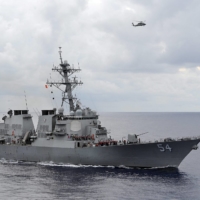 The U.S. Navy guided-missile destroyer USS Curtis Wilbur patrols in the Philippine Sea in 2013. | U.S. NAVY / VIA REUTERS