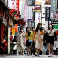 Shoppers in Seoul's Myeongdong shopping district in May 2020.   |  REUTERS