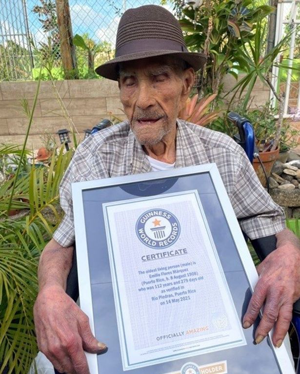 Emilio holding his Guinness World Records certificate