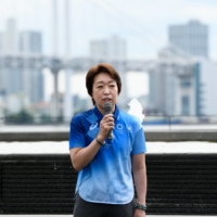 Seiko Hashimoto, president of the Tokyo Organizing Committee, speaks during a media tour at the athletes village for the Tokyo Games on June 20. Suspected filming and photography of a sexual nature will be banned at competition venues. | BLOOMBERG