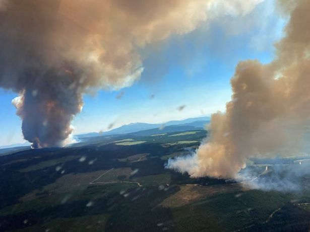 Scorched British Columbia as two plumes of smoke rise high from the Long Loch wildfire and the Derrickson Lake wildfire