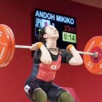 Ando lifted 120 kg in her final jerk attempt Tuesday to clinch the bronze medal. | KYODO