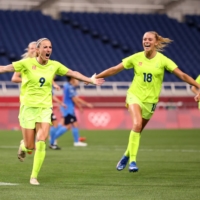 Kosovare Asllani (left) celebrates after scoring Sweden's third goal. | REUTERS