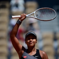 Japan's Naomi Osaka celebrates after winning against Romania's Patricia Maria Tig during the French Open in Paris in May. 

 | AFP-JIJI