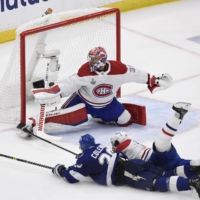 Lightning center Blake Coleman (left) scores past Canadiens goalie Carey Price in the second period of Game 2 of the Stanley Cup Final in Tampa, Florida. | USA TODAY / VIA REUTERS