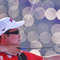 Takaharu Furukawa of Japan in action in the bronze medal match of the men's individual archery competition on Saturday at Yumenoshima Archery Field.  | REUTERS