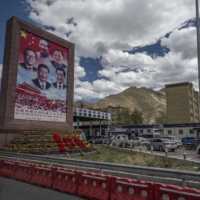 A billboard showing the leaders of China, including President Xi Jinping, during a government-organized tour in May for journalists in Lhasa, in the Tibet Autonomous Region of China. | GETTY IMAGES / VIA BLOOMBERG