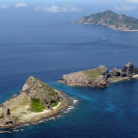 Two Chinese coast guard ships sailed in Japanese territorial waters off the Senkaku Islands in Okinawa Prefecture on Saturday. | KYODO