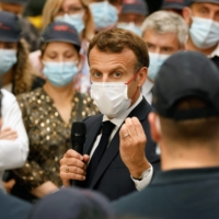 French President Emmanuel Macron addresses workers during a visit to a Bagneres-de-Bigorre southwestern France, on Friday. | AFP-JIJI