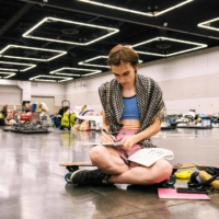 A woman rests at the Oregon Convention Center cooling station in Portland on June 28 amid a heatwave that moved over much of the United States and Canada.   | AFP-JIJI