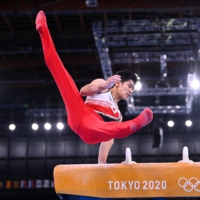 Daiki Hashimoto performs on the pommel horse during the men's gymnastics team competition at the Tokyo Olympics on Monday. | REUTERS