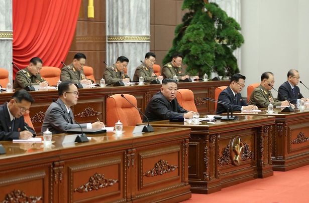 North Korean leader Kim Jong Un (C) attending an enlarged meeting of the 2nd Political Bureau of the Party Central Committee at the 8th congress of the Workers' Party of Korea at the Party Central Committee Headquarters in Pyongyang.